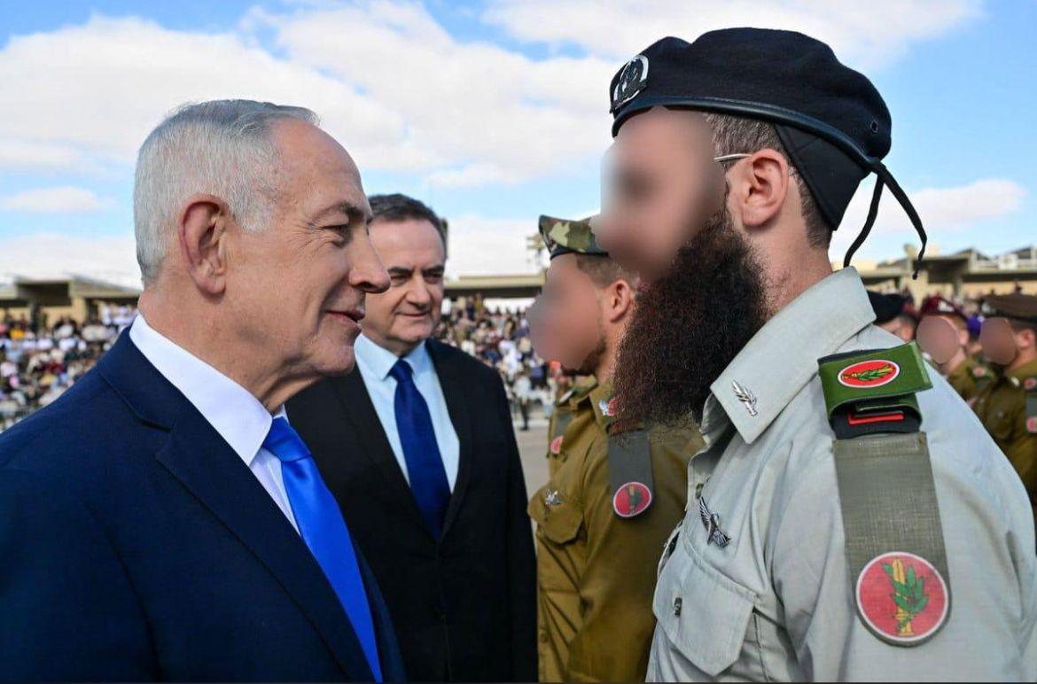 Rebbetzin Sarah Blooming of Chabad of Potomac shared a powerful milestone as her son Yosso was commissioned as an IDF officer โ standing proudly with his parents and later seen in conversation with Prime Minister Benjamin Netanyahu
