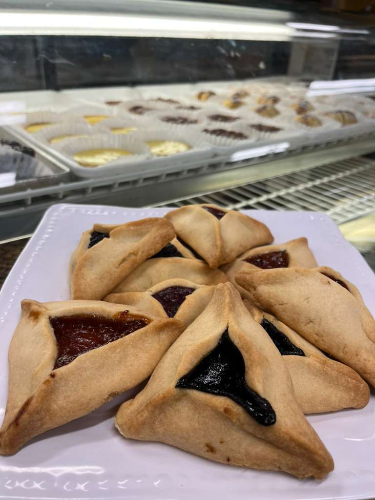 Fresh chocolate and raspberry kosher hamantaschen baked in Silver Spring for Purim at The Kosher Pastry Oven