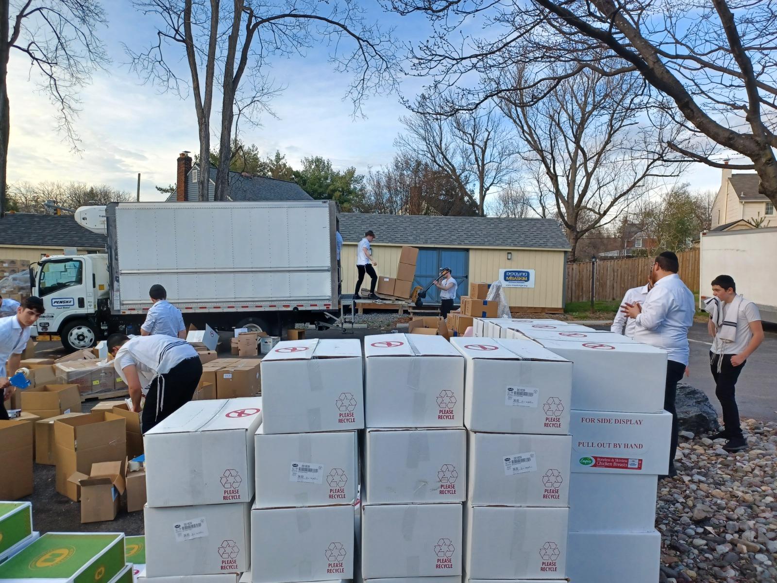 Yeshiva of Greater Washington students volunteering to pack kosher for Passover food boxes for Yad Yehuda families in Silver Spring Maryland