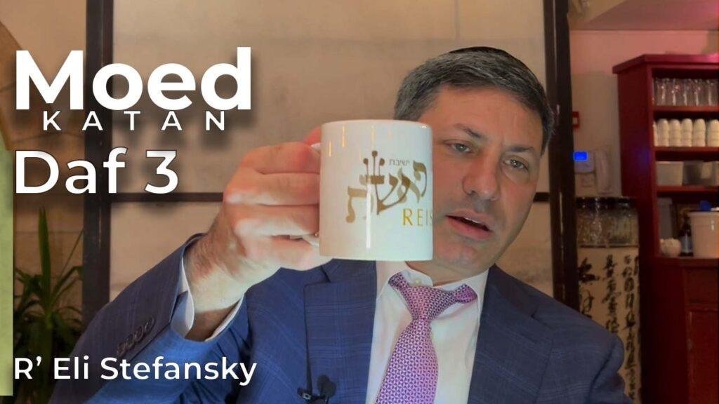 Rabbi Eli Stefansky holding a Yeshivat Reishit mug — read the Daf Yomi Megillah siyum story