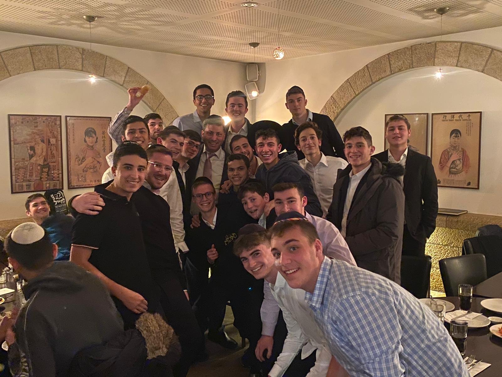 Reishit students celebrating their Megillah siyum with Rabbi Eli Stefansky at Sheyan in Jerusalem