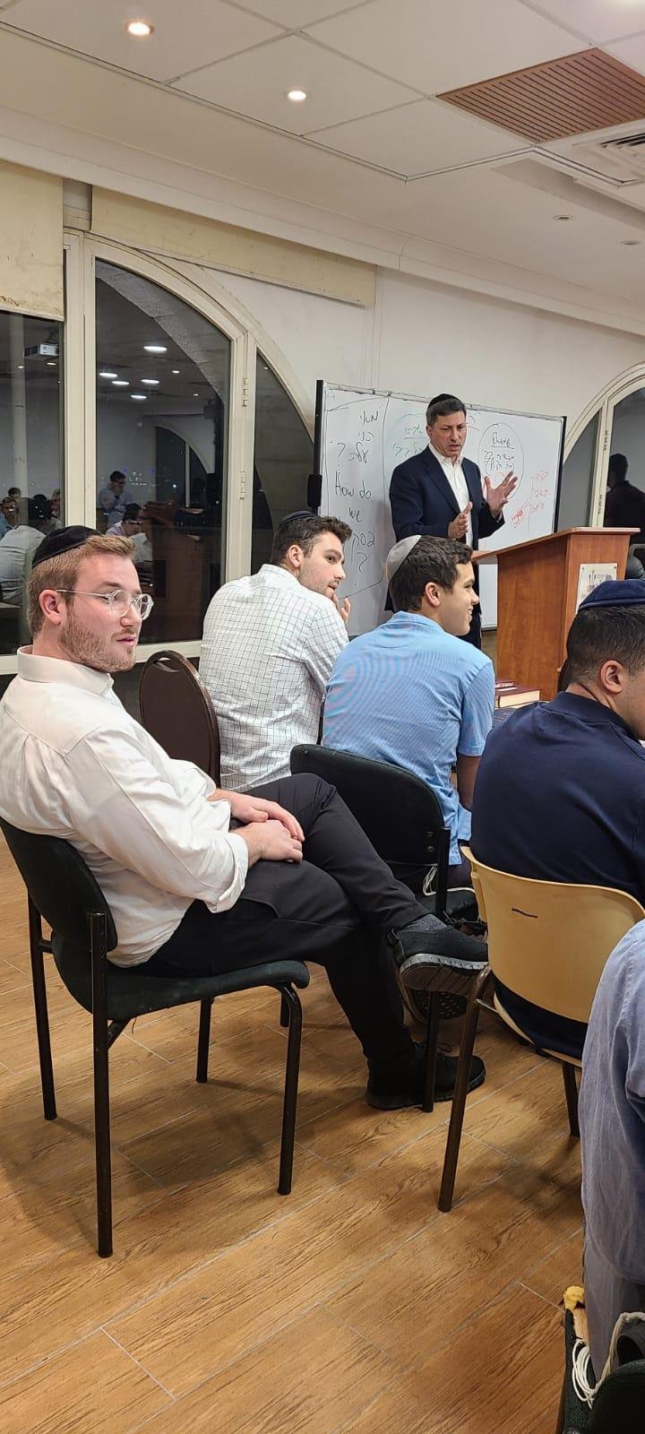 Reishit students listening to Rabbi Eli Stefansky in the beis midrash