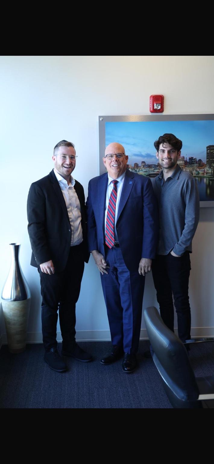 Three men posing together during a Washington Jewish Journal interview visit